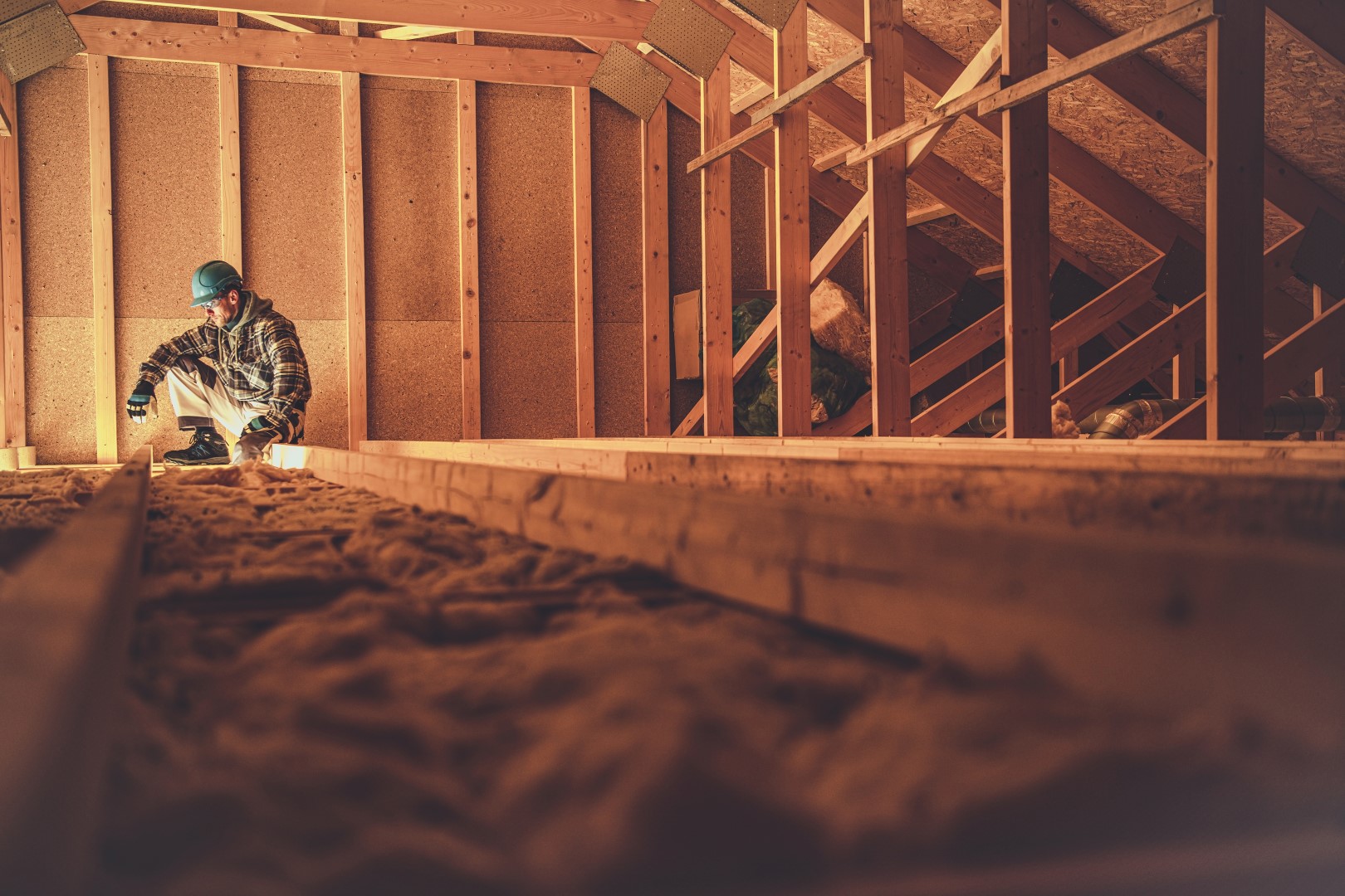 worker working in a house crawl space