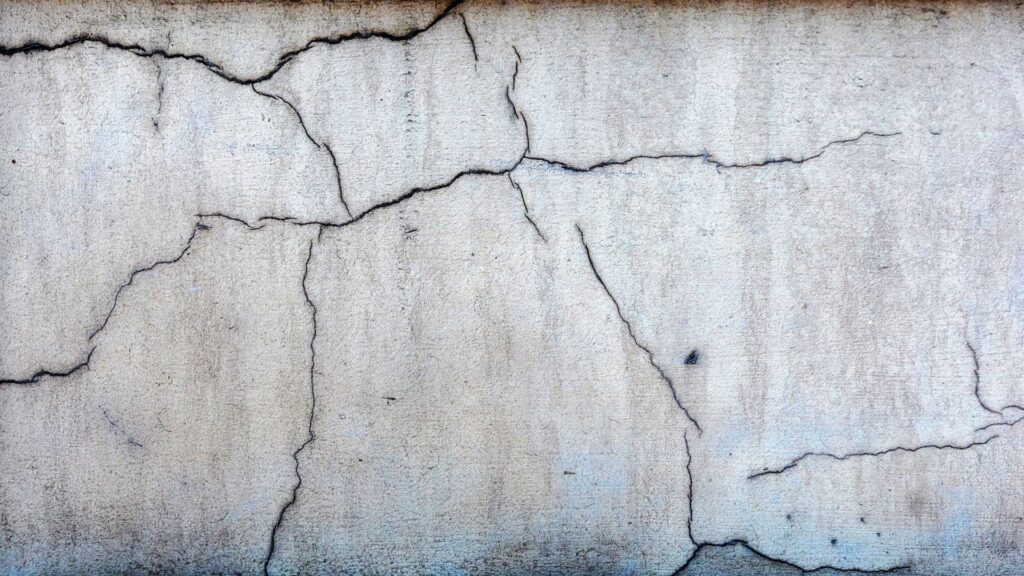 Cracks in basement wall signal structural issues often found in a foundation inspection.